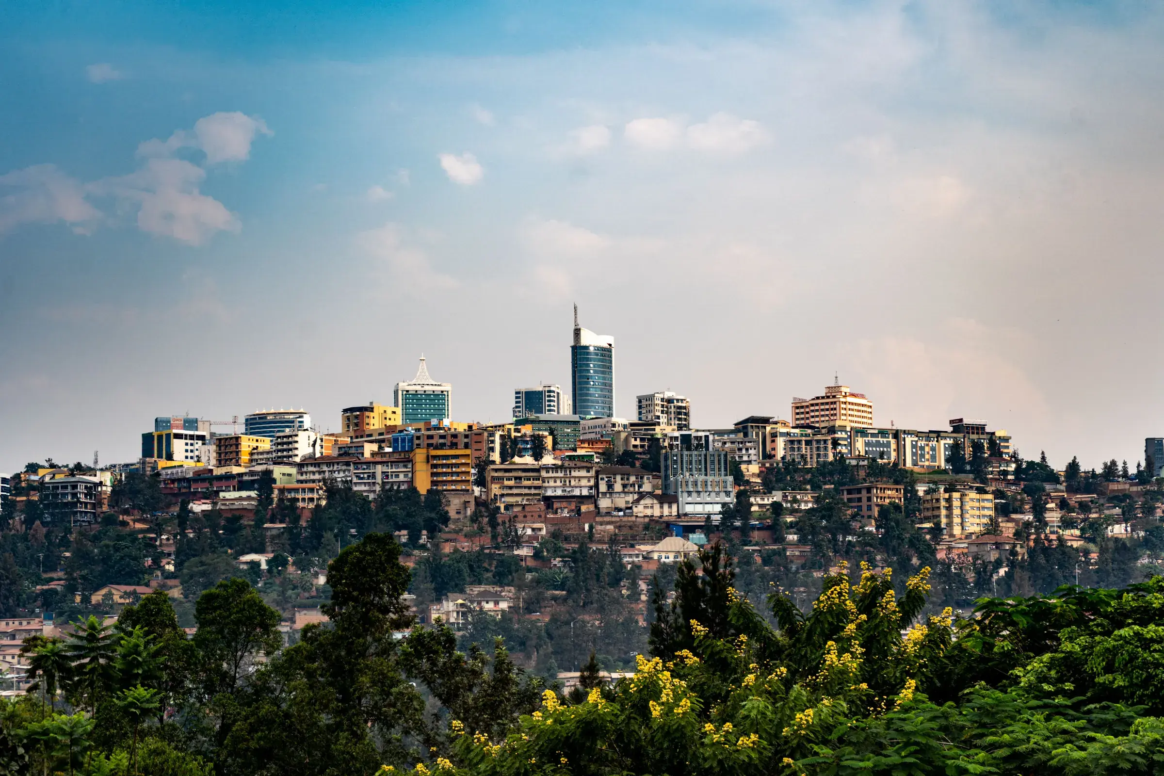 Kigali spreads across its hills, the city rising green and bright.