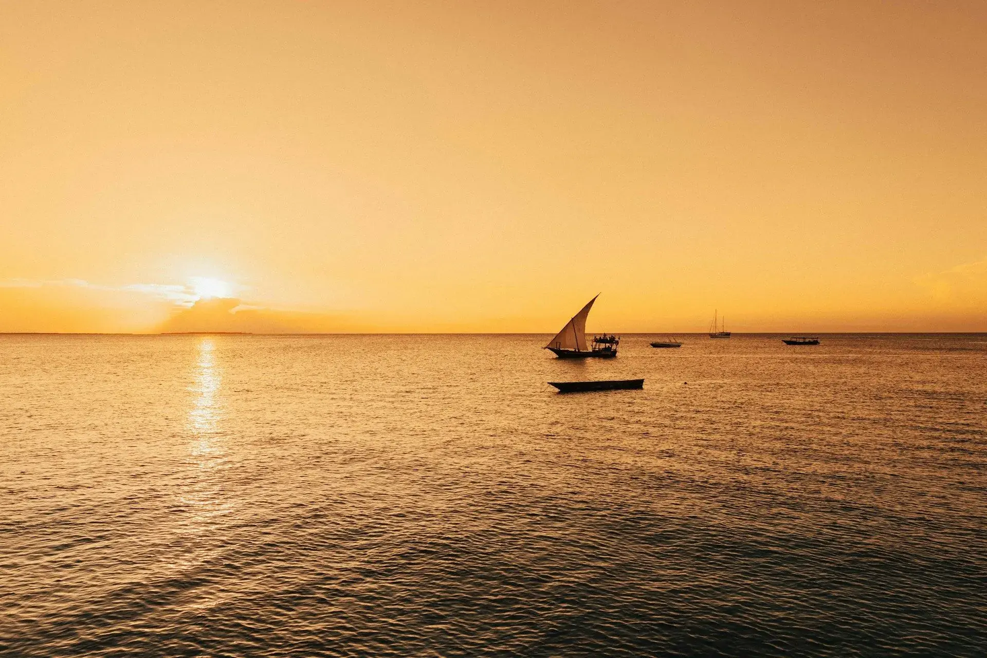A dhow drifts off Paje as the sun goes down over the channel.