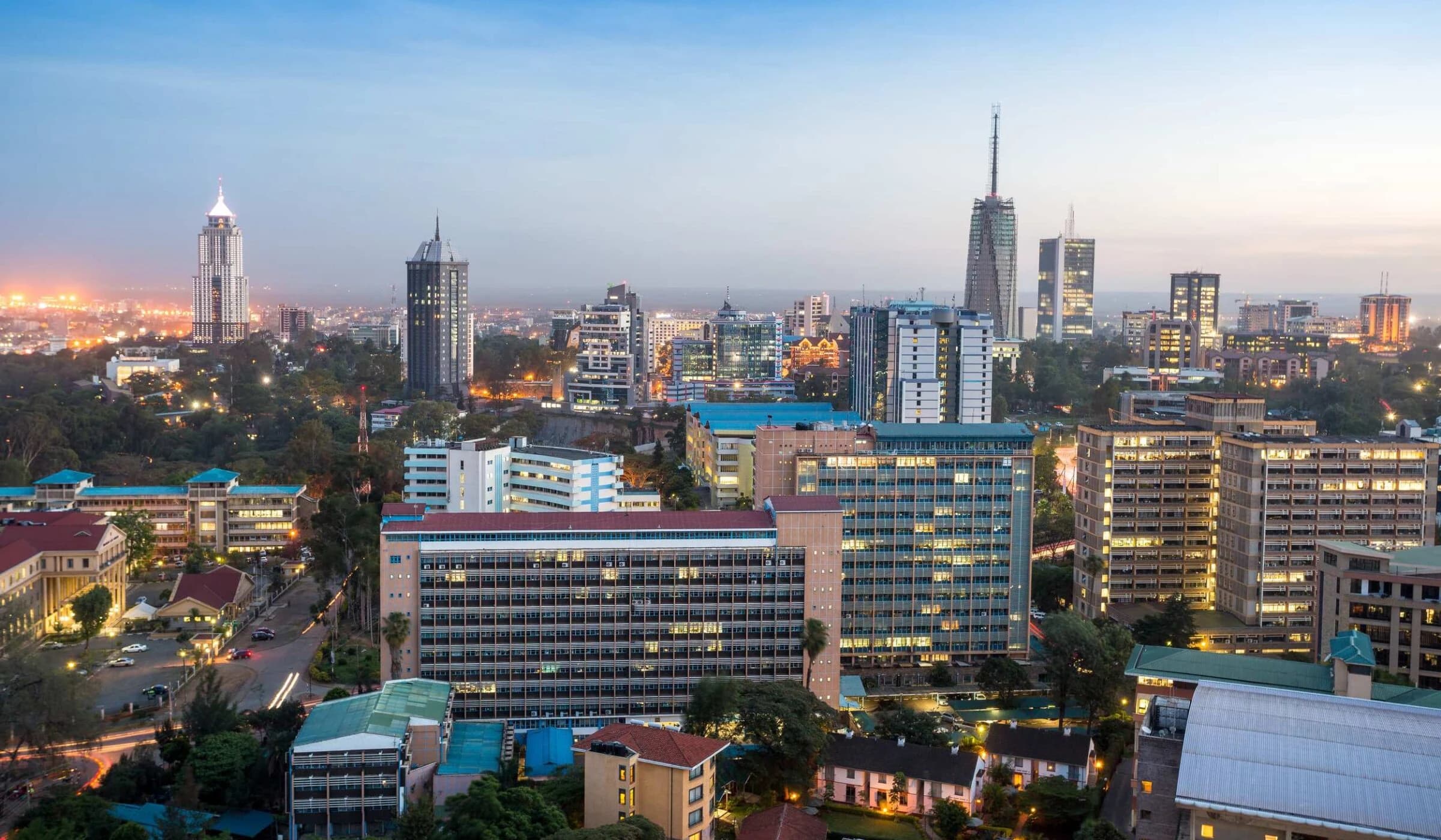 Nairobi skyline at dusk with towers and city lights