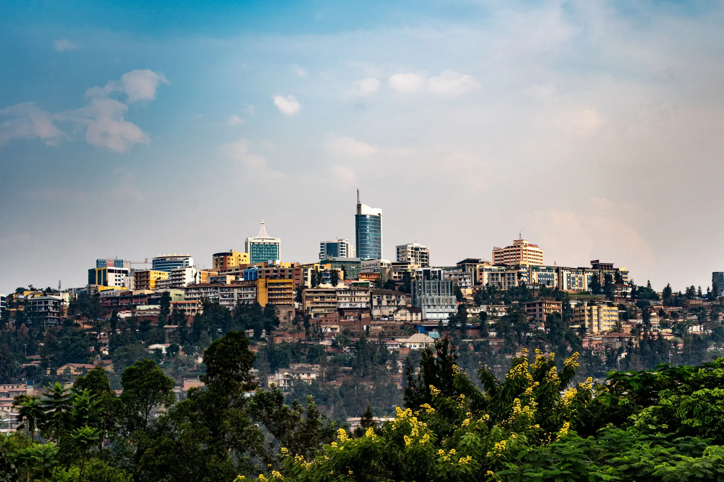 Kigali spreads across its hills, the city rising green and bright.