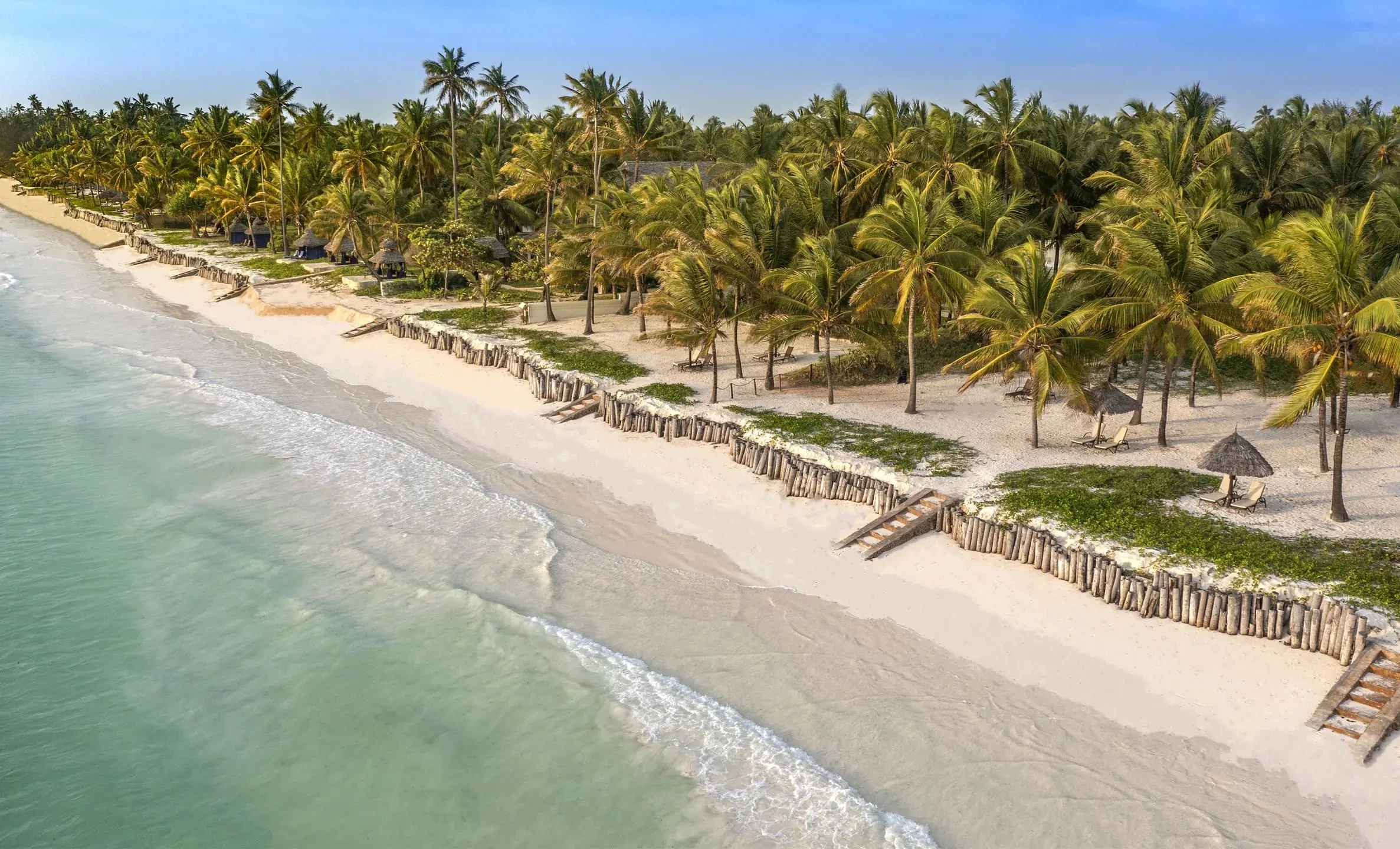 Palms lean over the long white beach at Bwejuu.