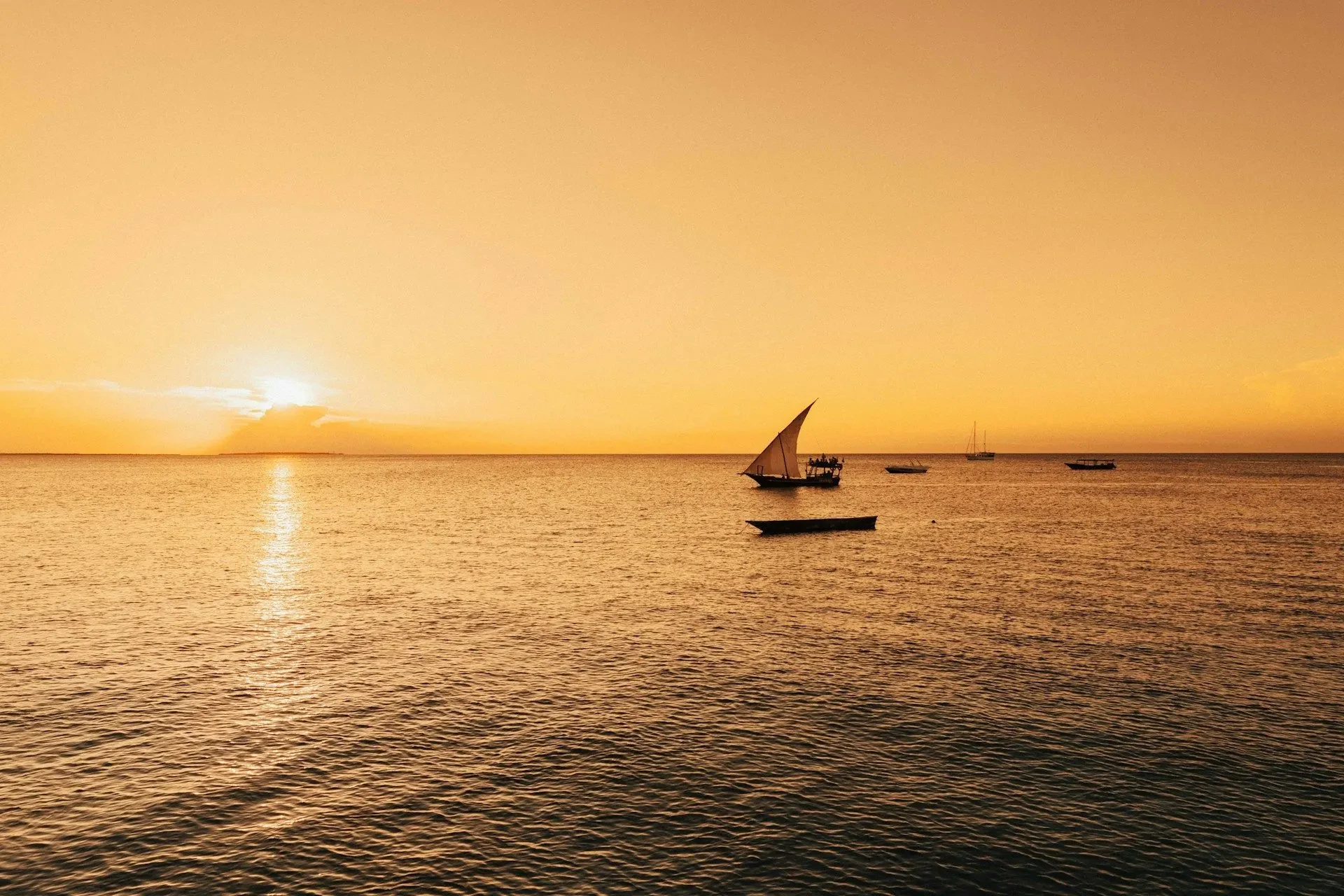 A dhow drifts off Paje as the sun goes down over the channel.