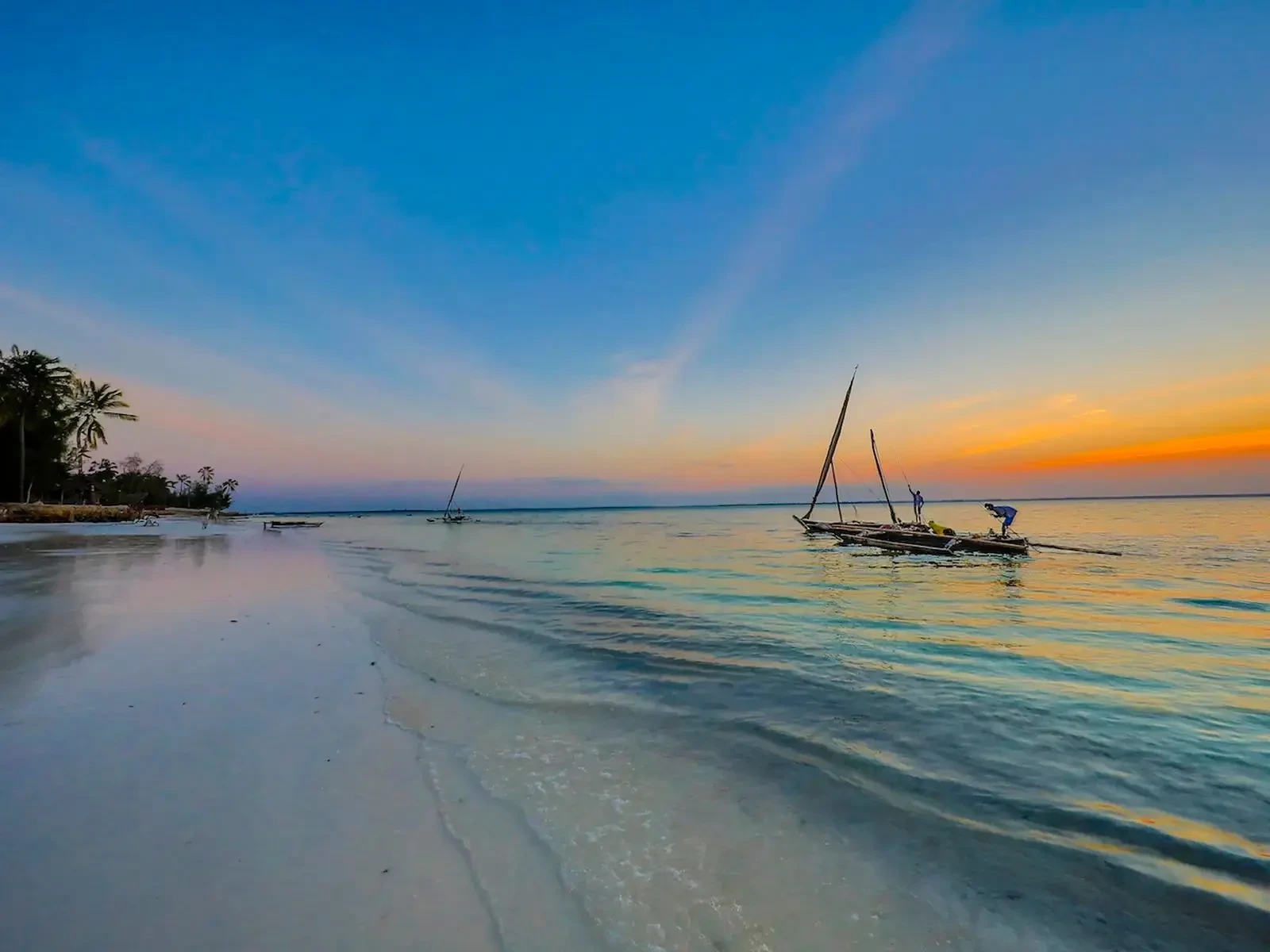 Boats ride the calm water off Michamvi at the close of the day.