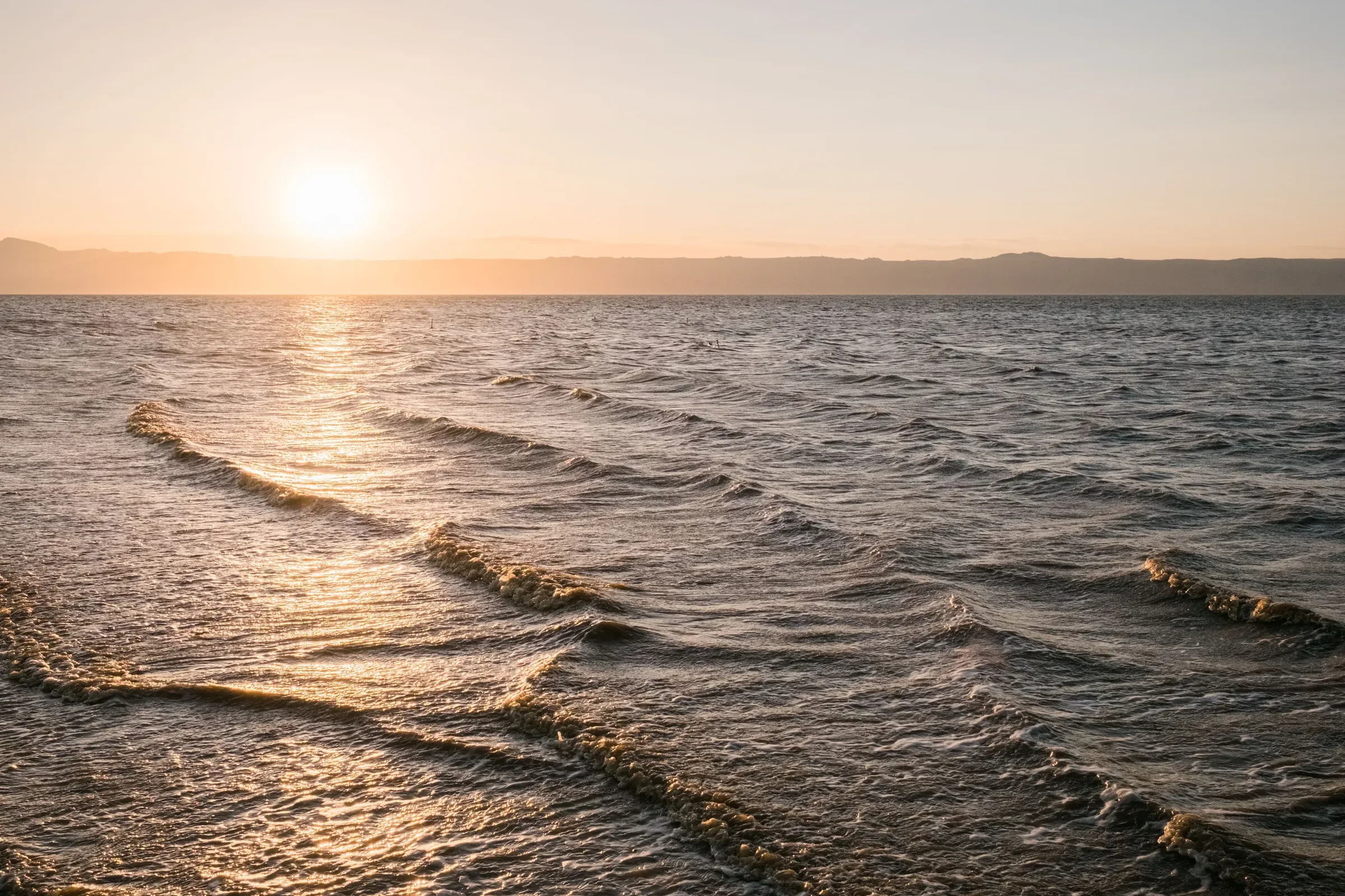 The sun sets over the still waters of Lake Eyasi.