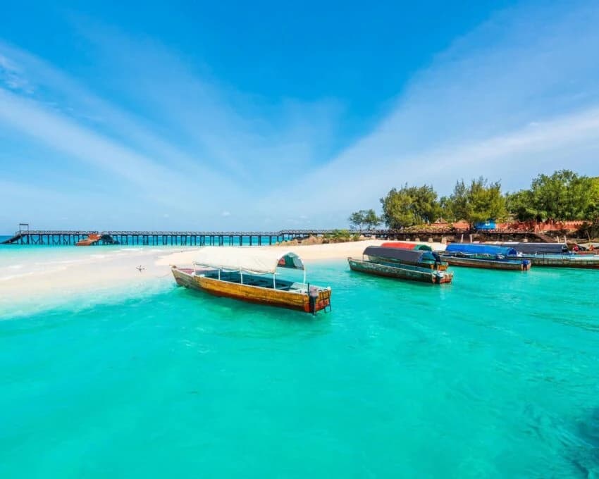 Wooden boats and a jetty on bright turquoise water