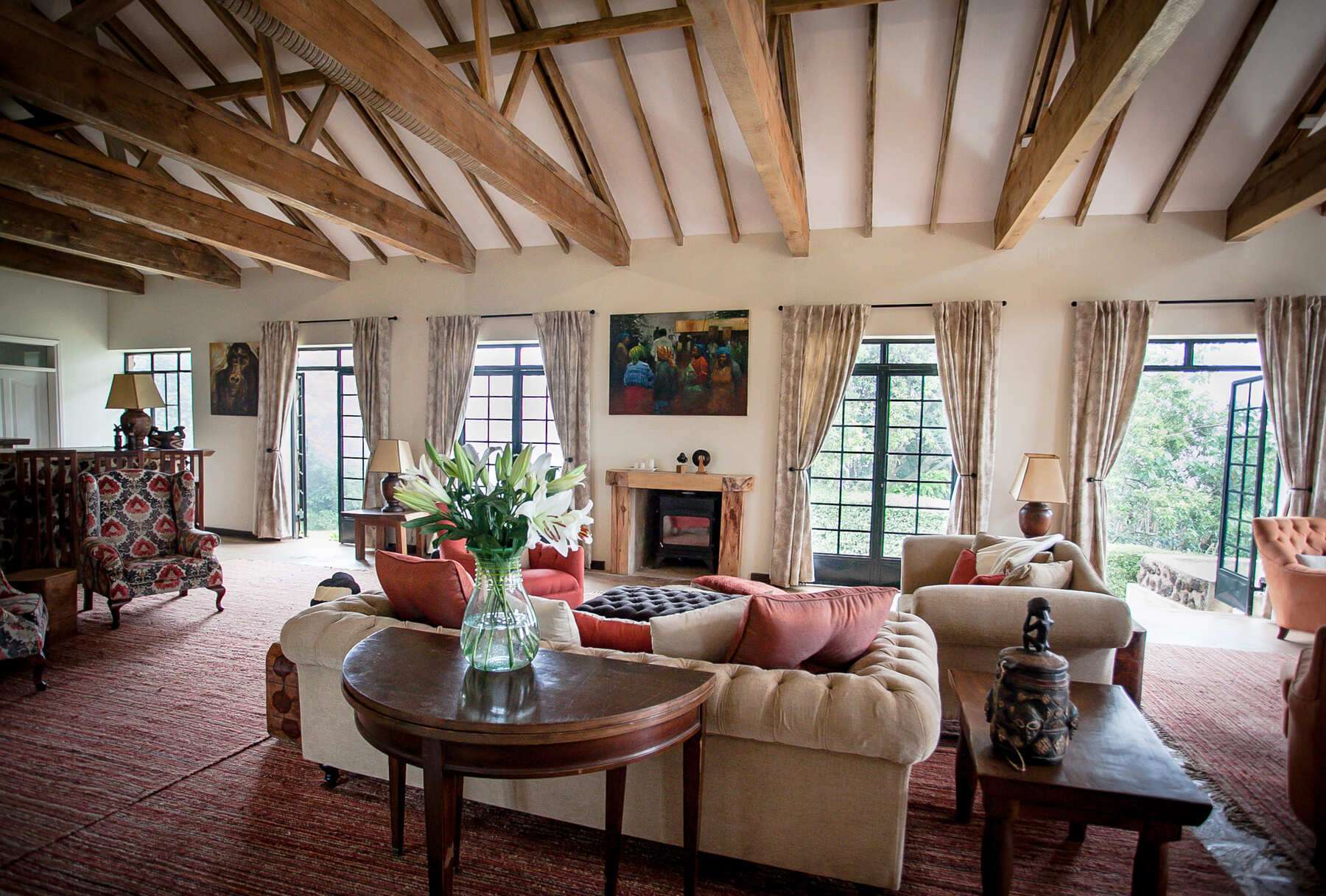 Cottage sitting room and fireplace at Clouds Mountain Gorilla Lodge