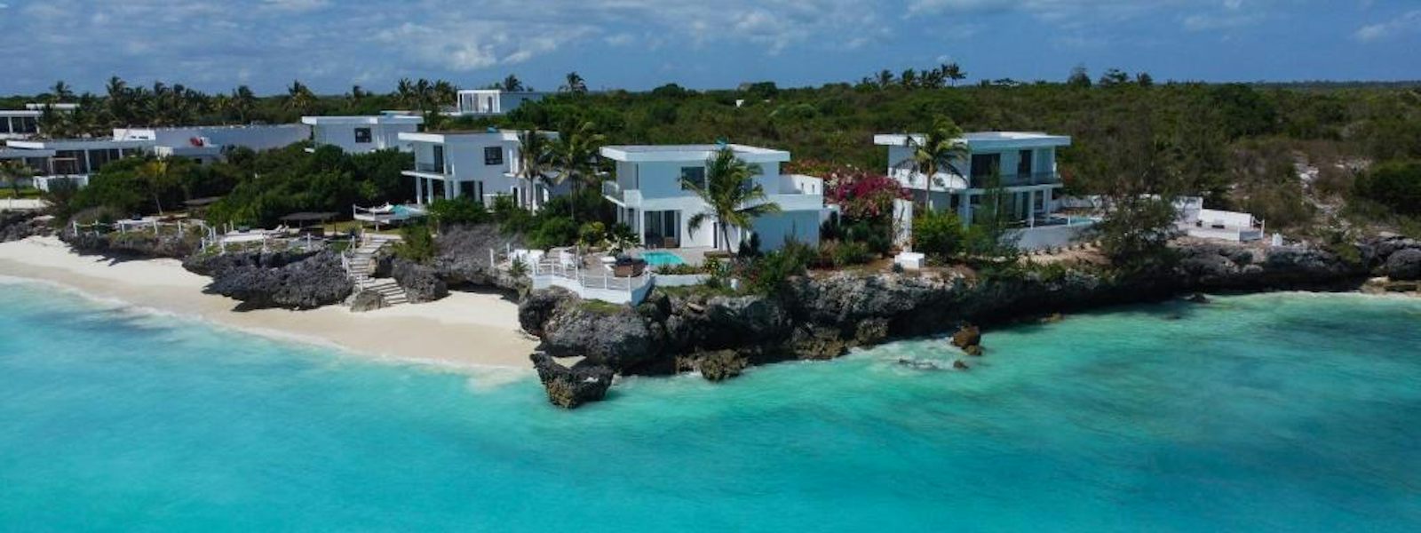 Coastal villas and pools above the shoreline at SafiraBlu