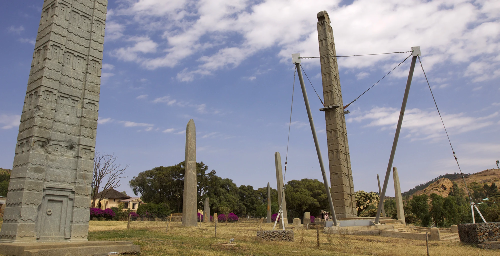 Tall carved granite stelae stand in the main stelae field at Axum.