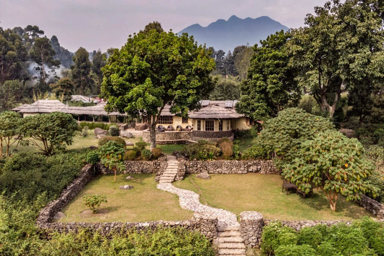 Lodges with garden pathway at Mount Gahinga Lodge