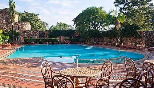 Tables and chairs at the bar next to the swimming pool. Nairobi Serena.