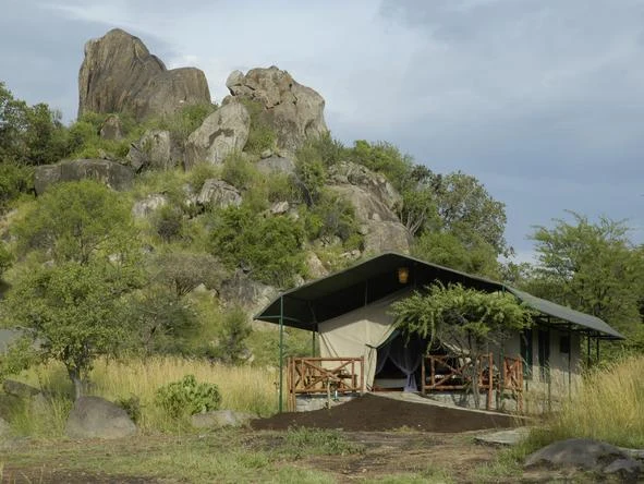 Safari tent beside granite rocks at Mbuzi Mawe Serena Camp