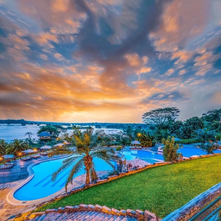 an aerial view of a resort with a pool