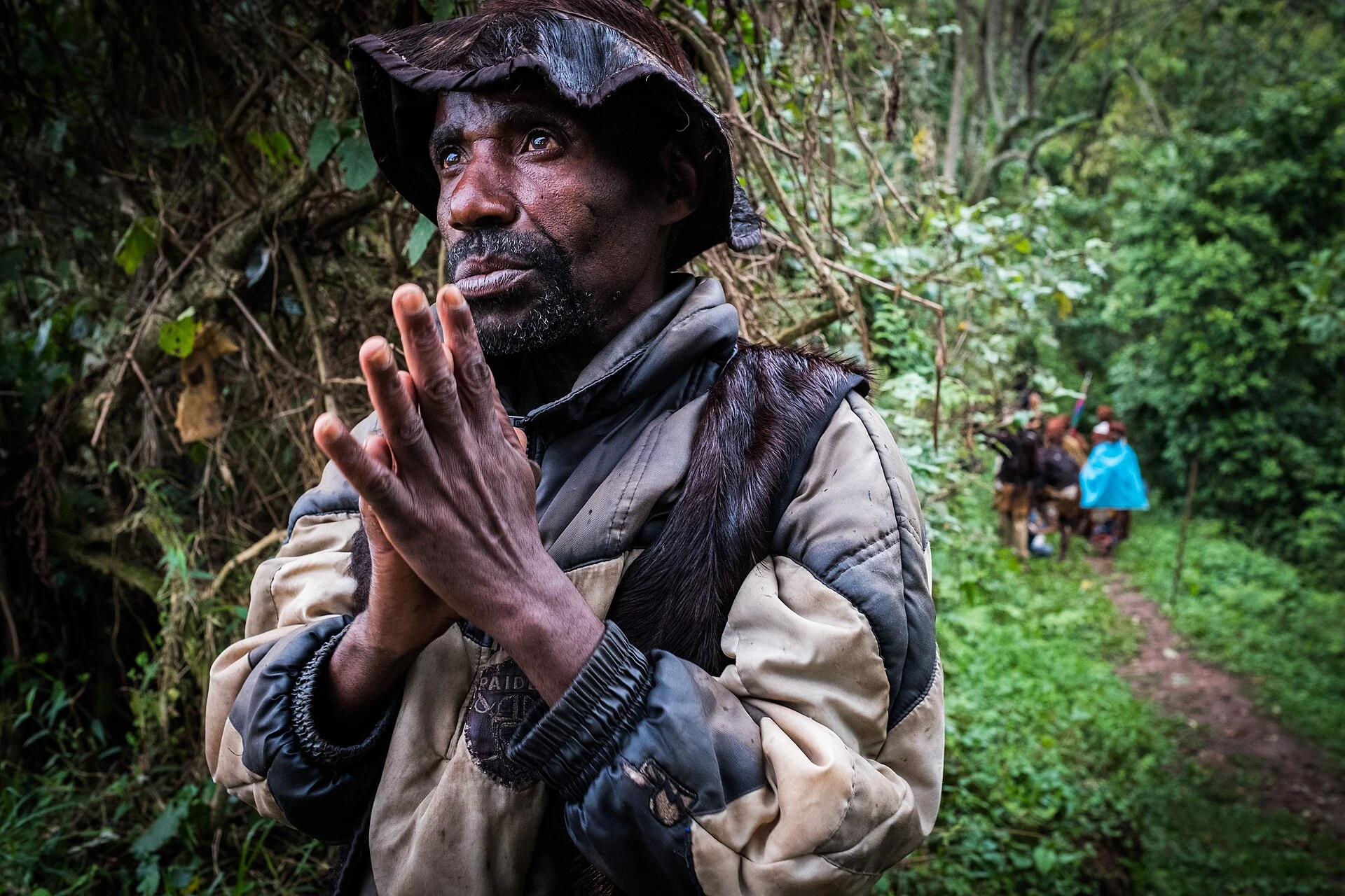 A Batwa guide speaking on the Buniga Community Forest Trail near Nkuringo