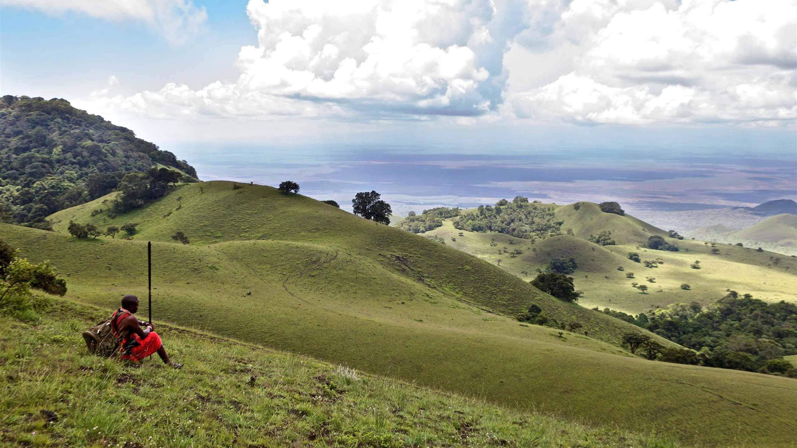 Green hills rolling away under a wide sky