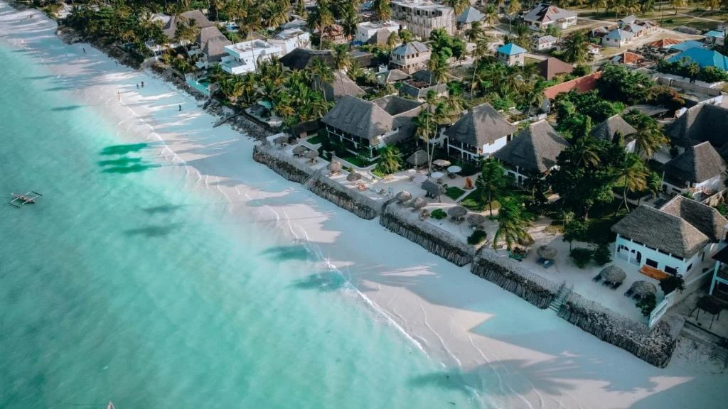 an aerial view of a resort on the beach