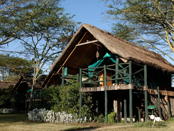Thatched guest accommodation and veranda at Sweetwaters Serena Camp