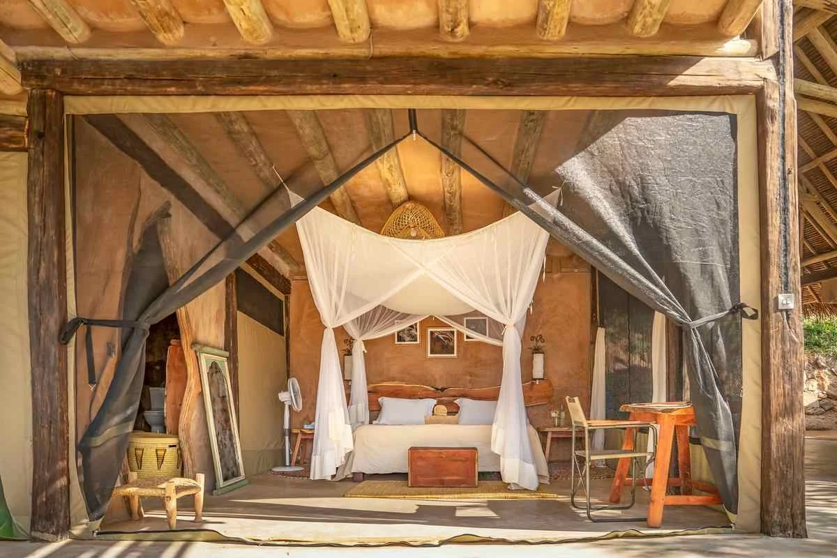 Tented bedroom with mosquito net