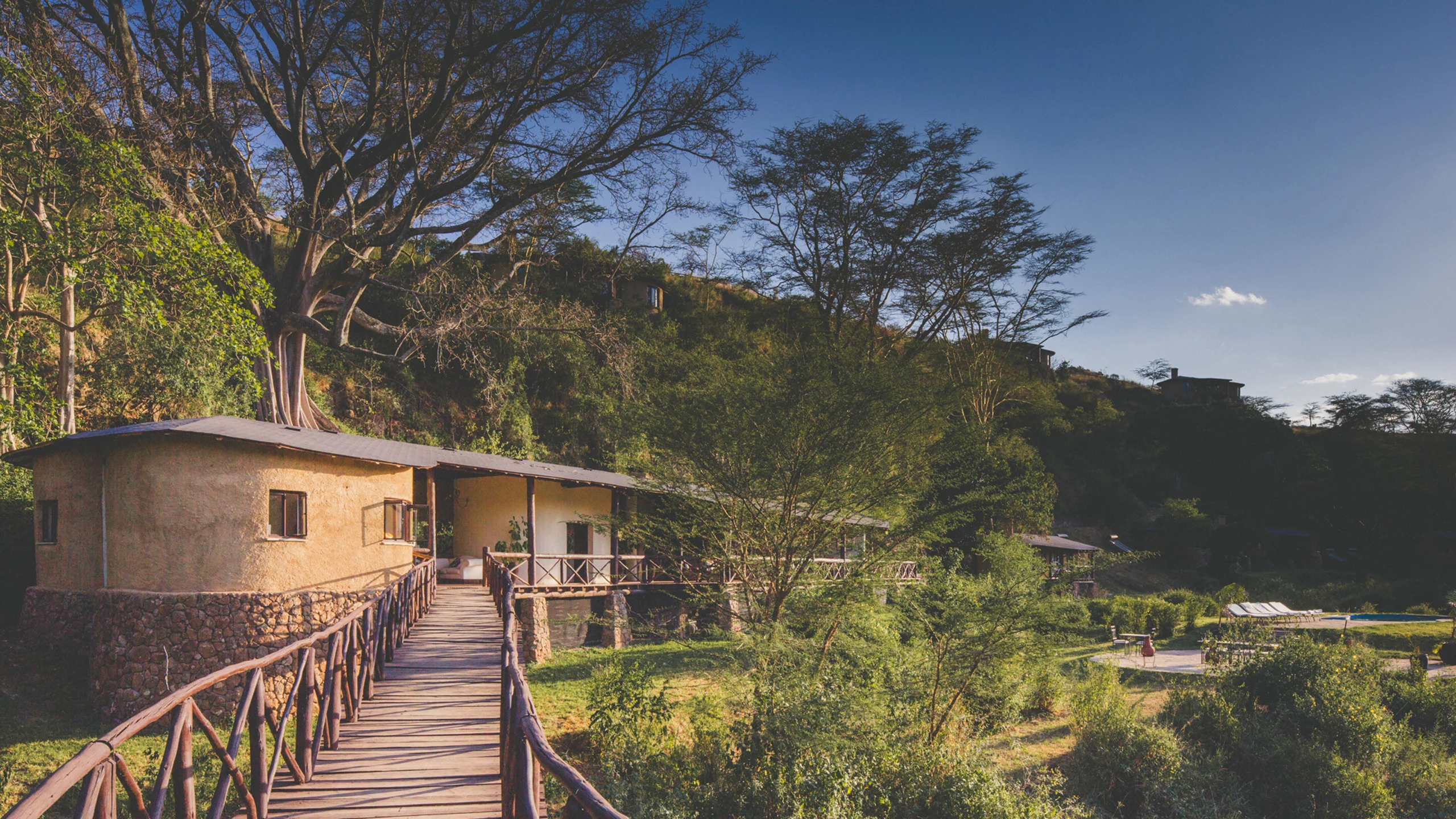 Lodge with raised walkway at The Emakoko