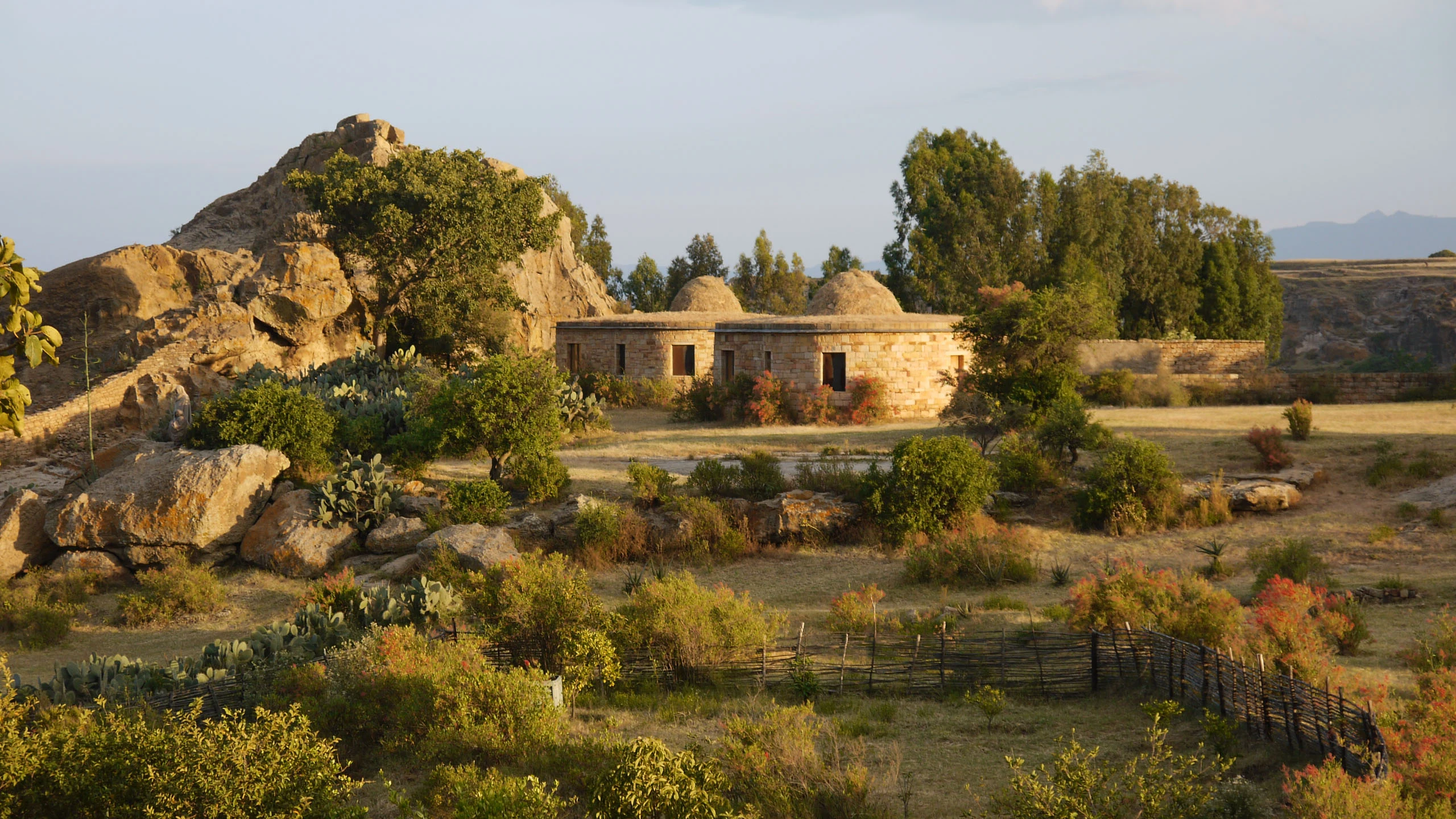 Stone cottage in rocky landscape at Gheralta Lodge
