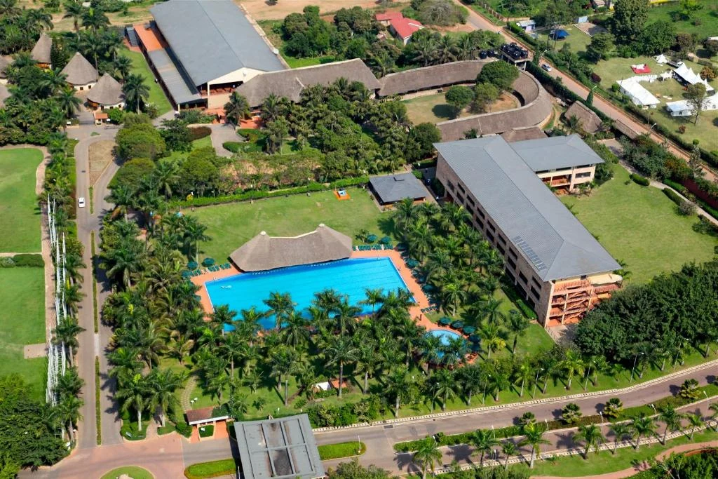 an overhead view of a resort with a swimming pool