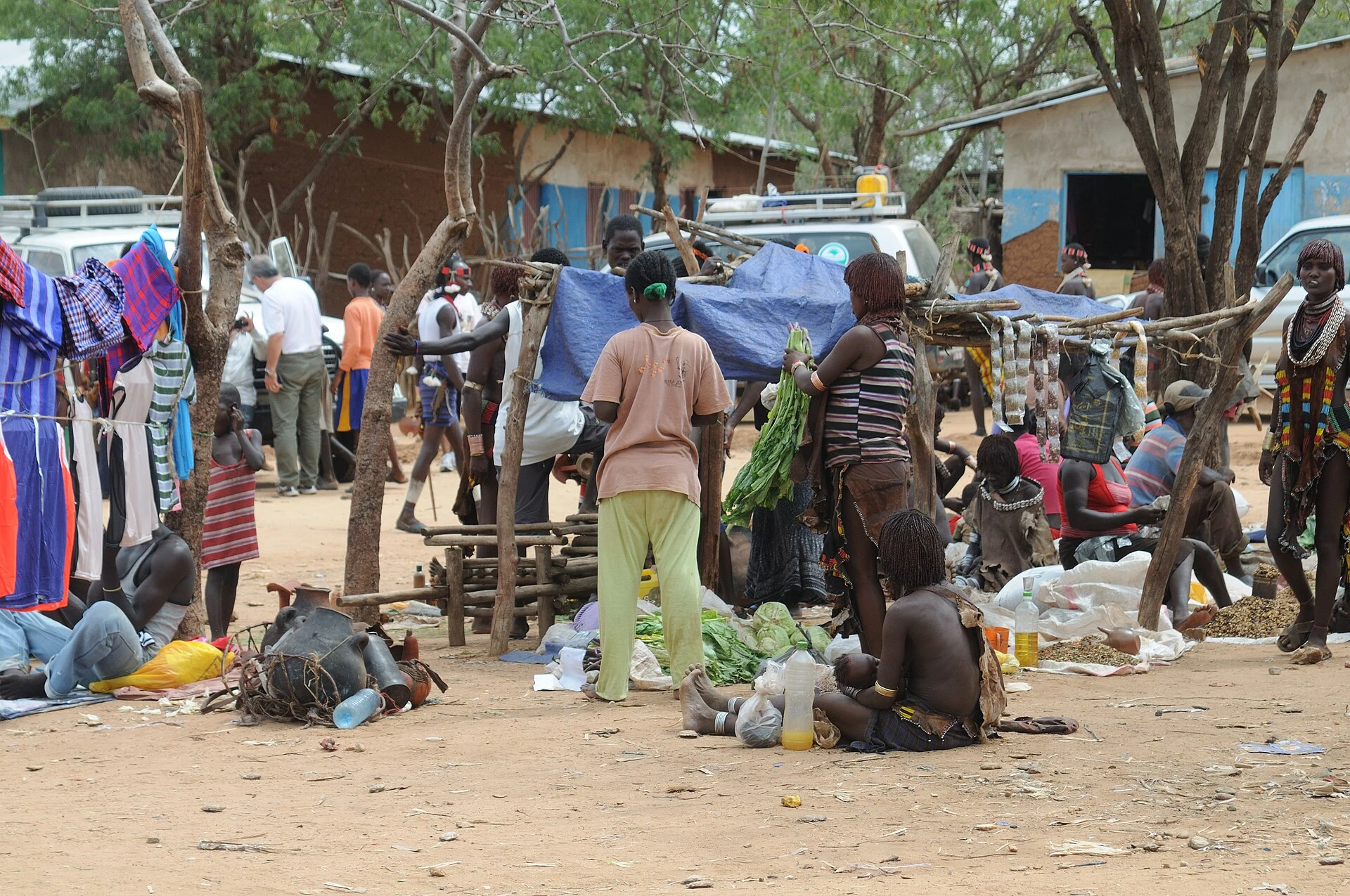 Shoppers and traders among clothing stalls at the market in Turmi.