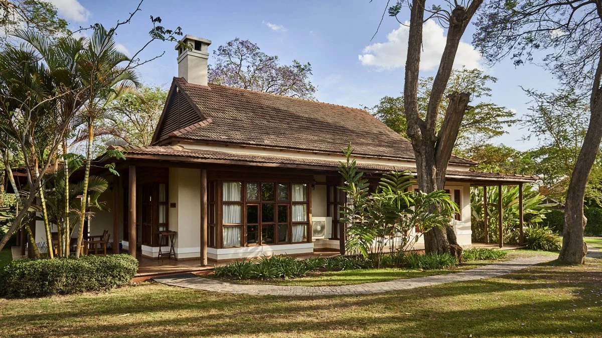 Cottage amid palm gardens at Legendary Lodge