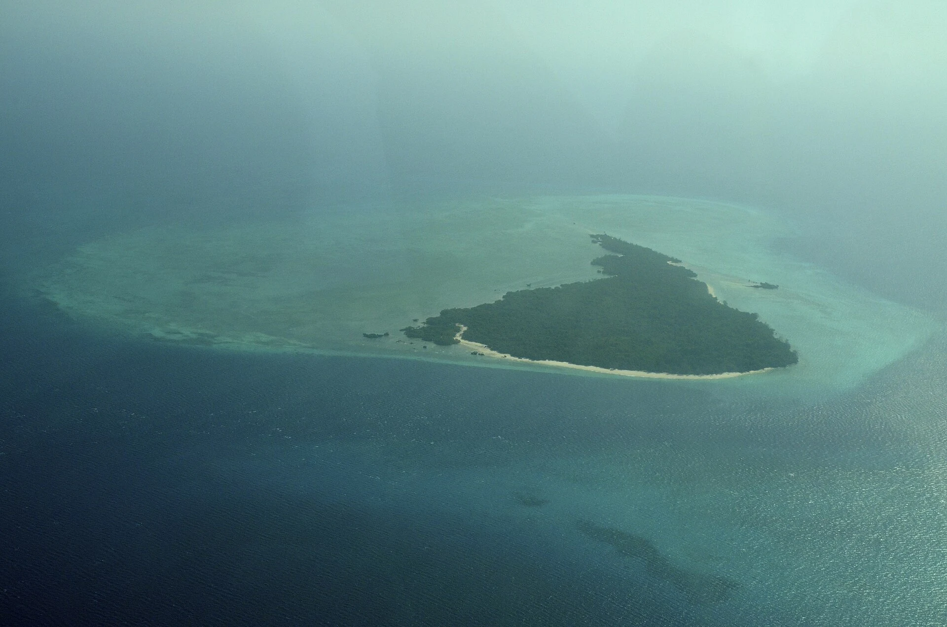 Misali Island and its surrounding coral reef seen from the air