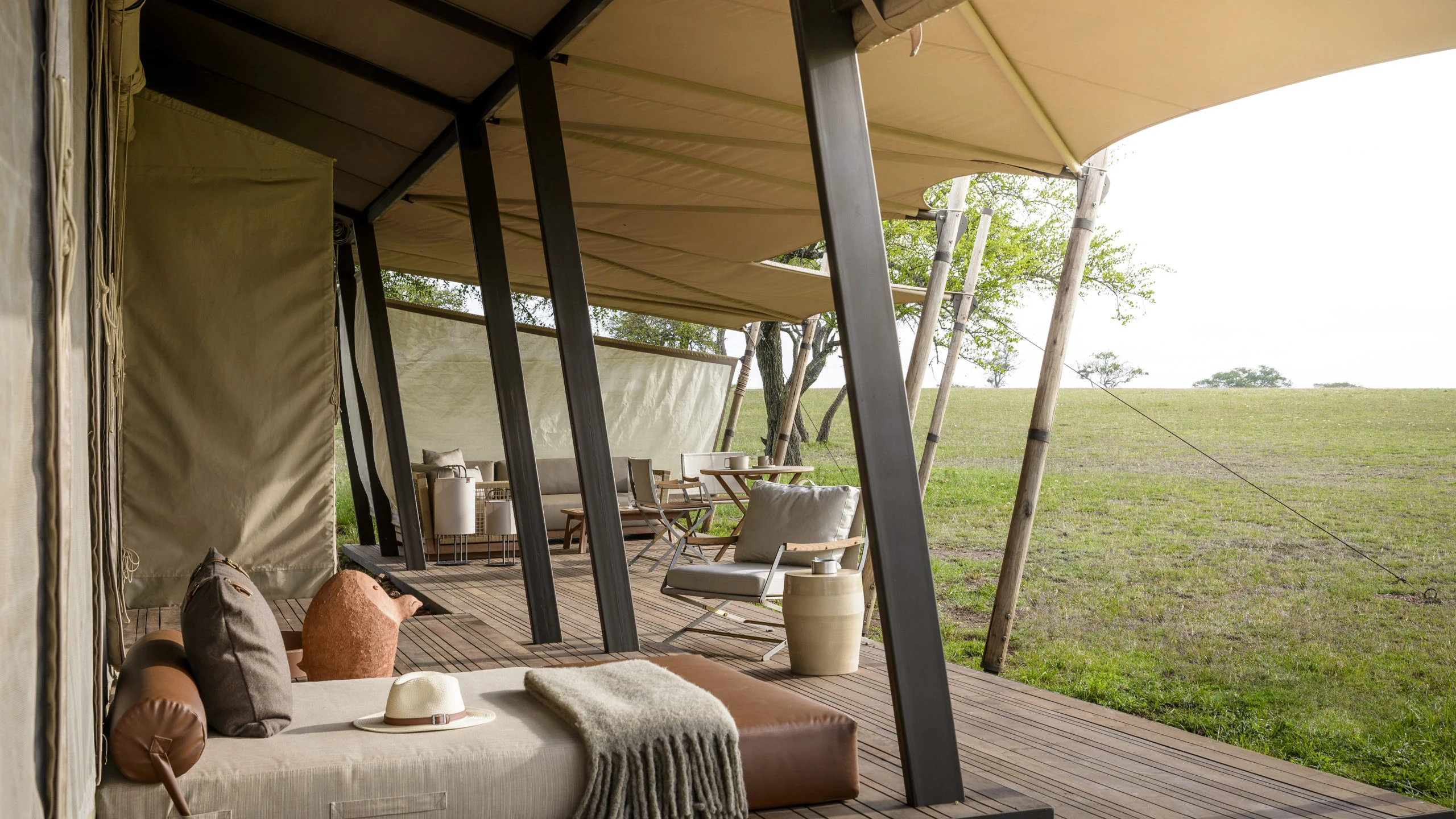 Canvas lodge veranda facing grassland