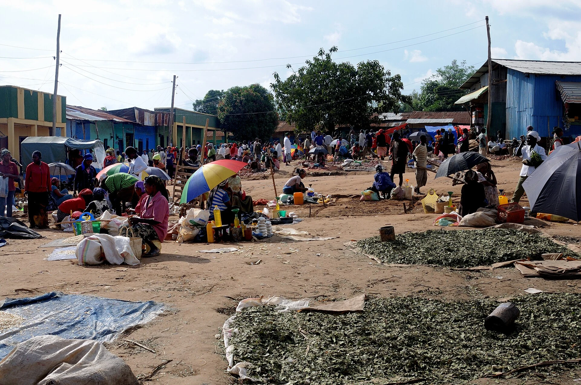 Traders sit among goods spread on the ground at the open-air market in Jinka.