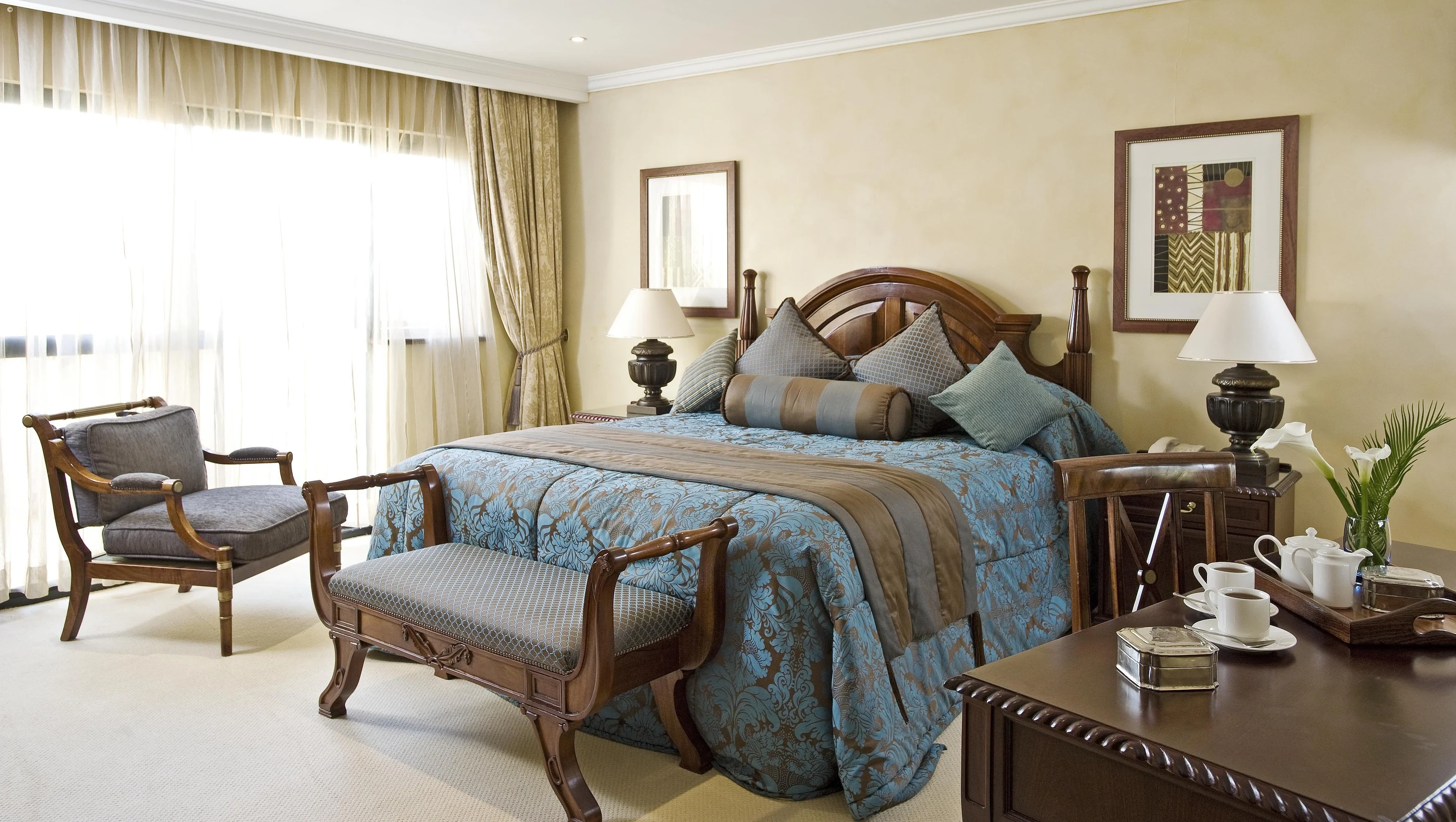 Bright bedroom with blue bedding