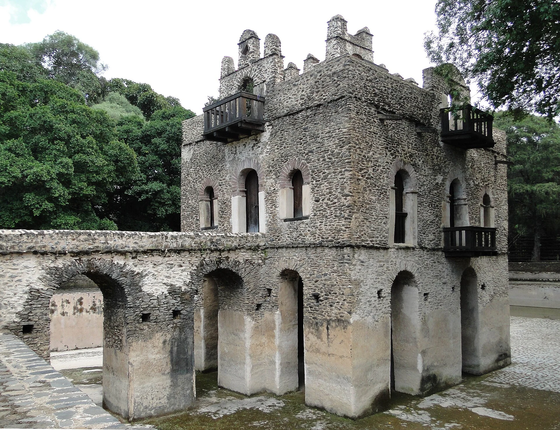 The stone pavilion and arched bridge of Fasilides' Bath in Gondar.