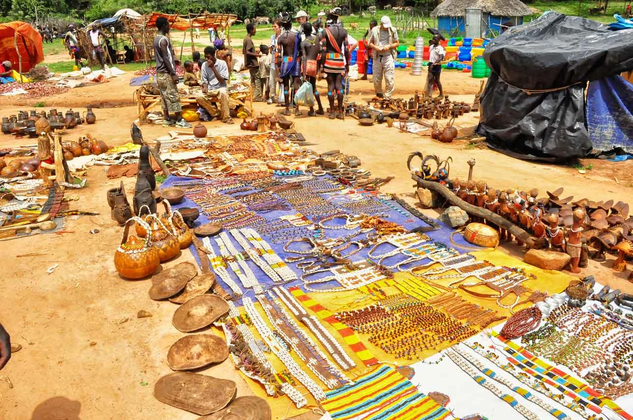 Gourds, beads and cloth laid out for sale at the Key Afer market.
