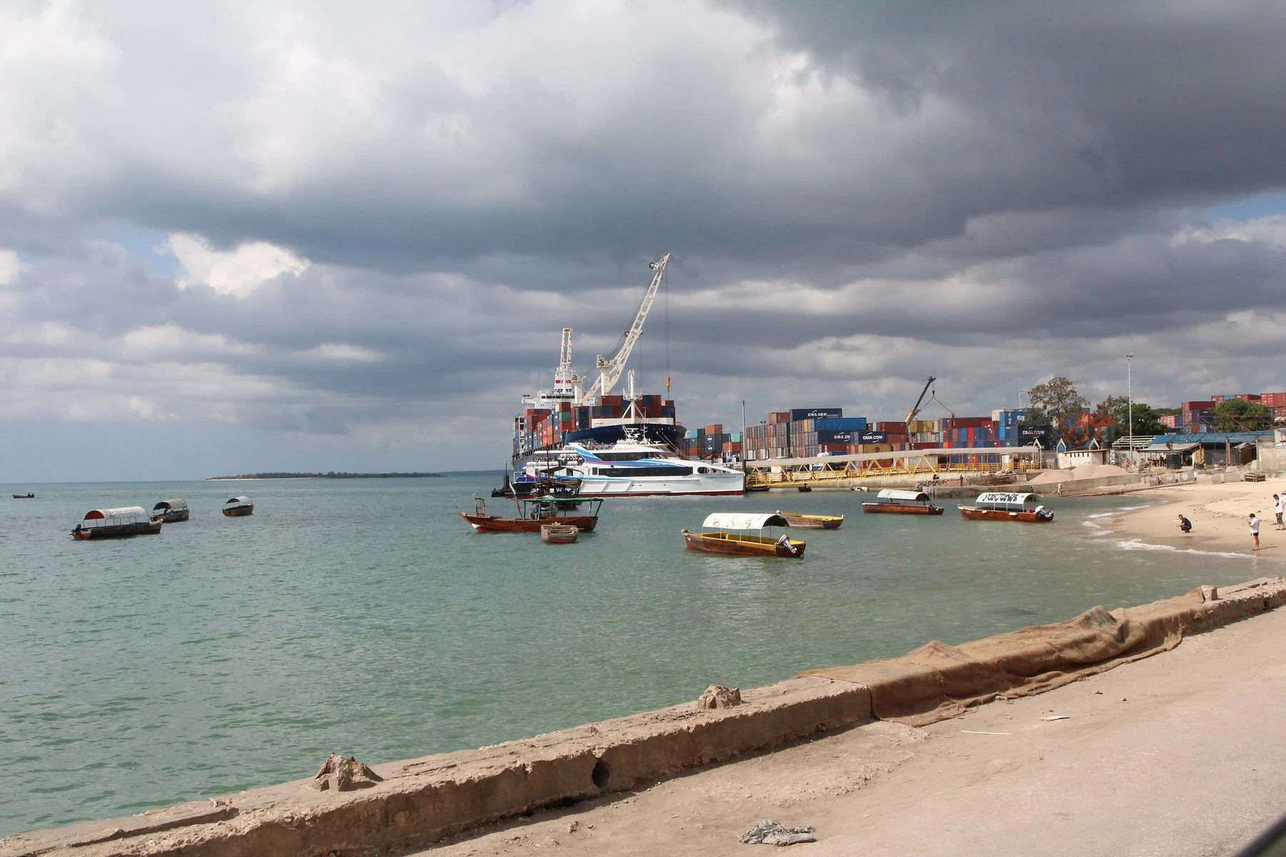 Large passenger ferry docked at Stone Town port across the harbour