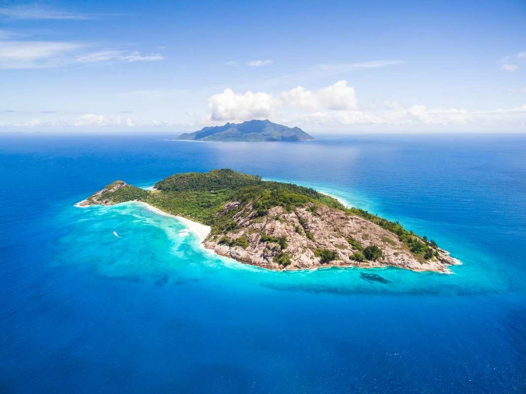Small island surrounded by turquoise water
