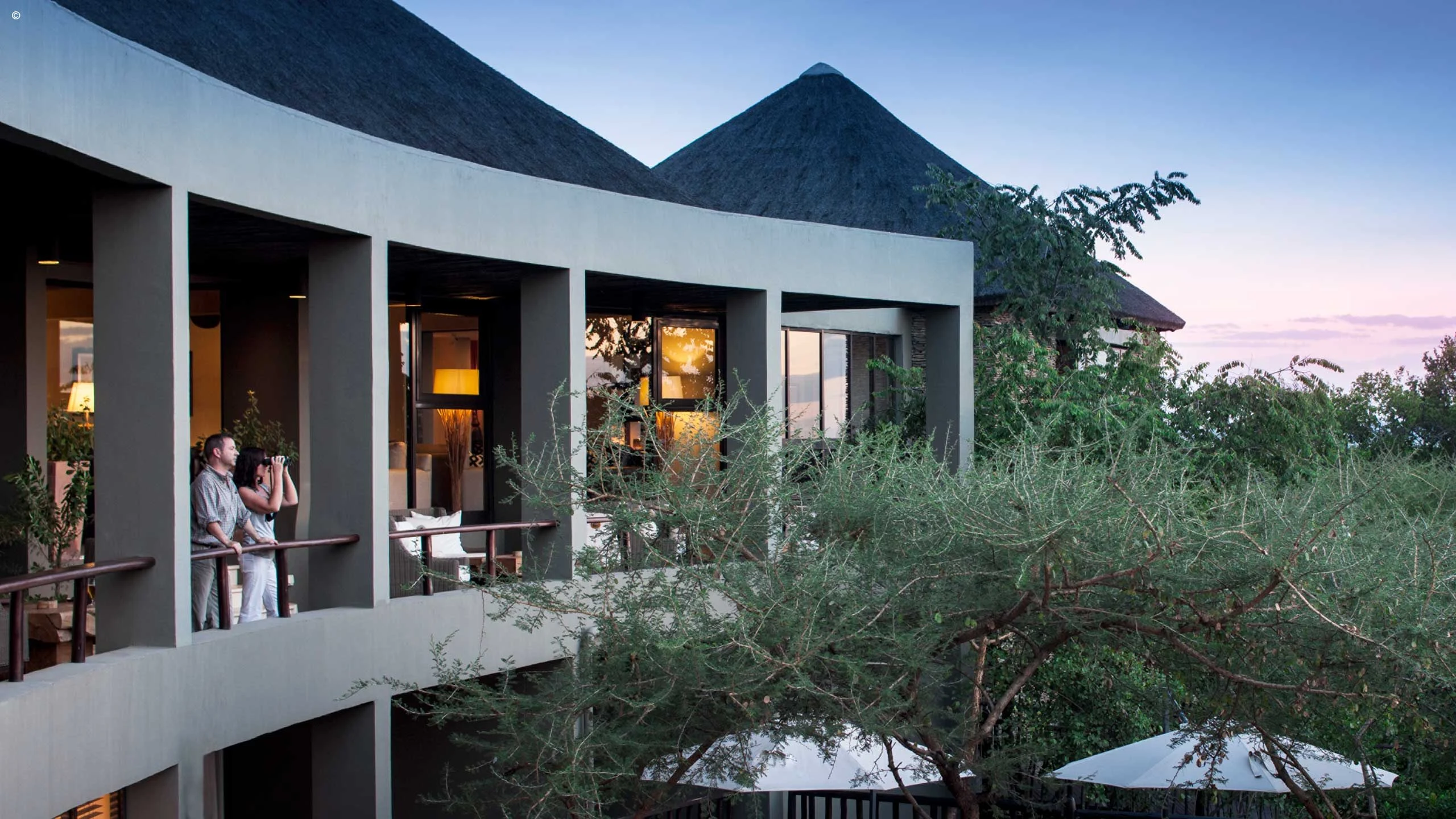 White lodge exterior with balconies at Four Seasons Safari Lodge Serengeti