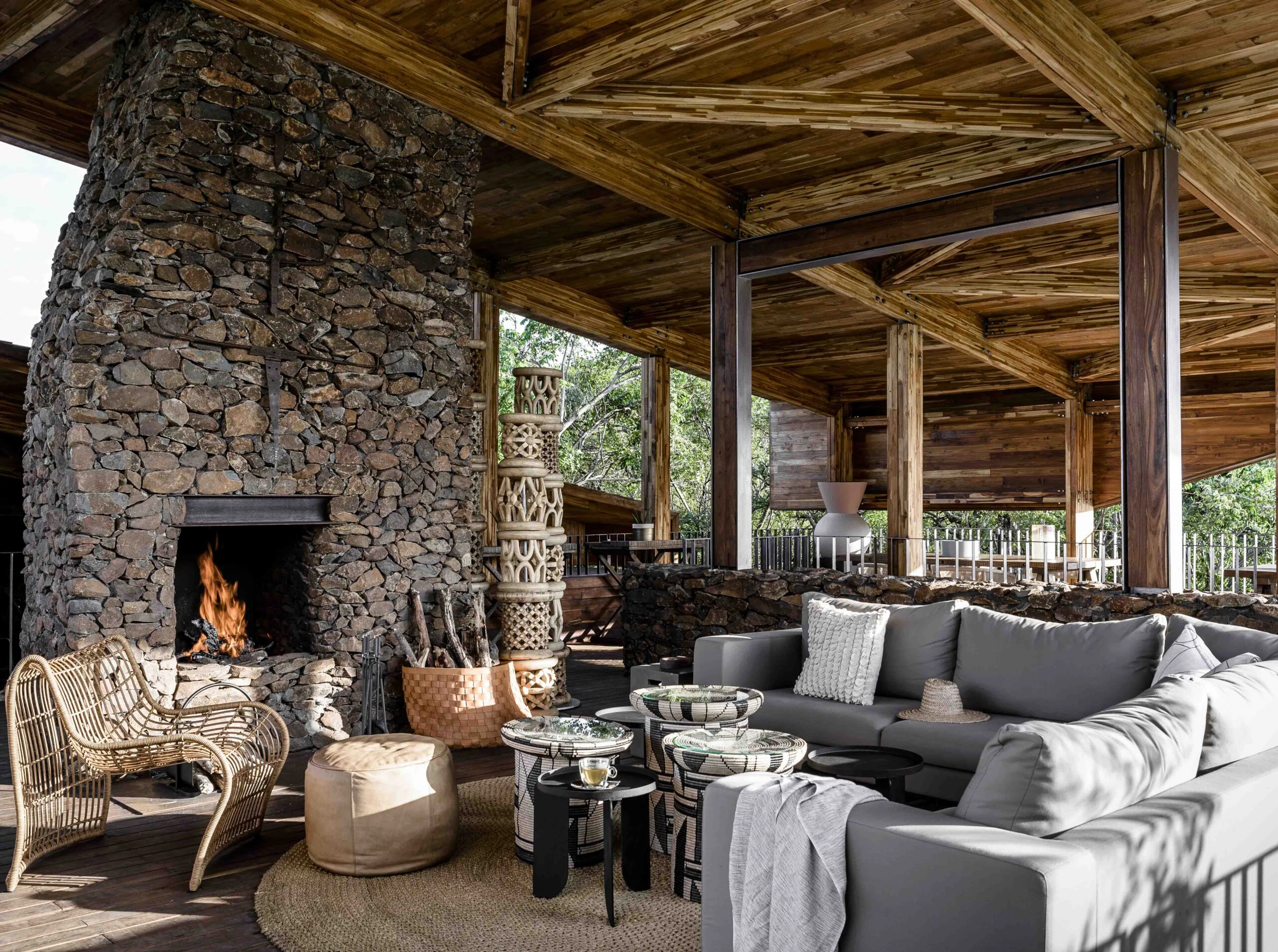 Covered lounge with stone fireplace