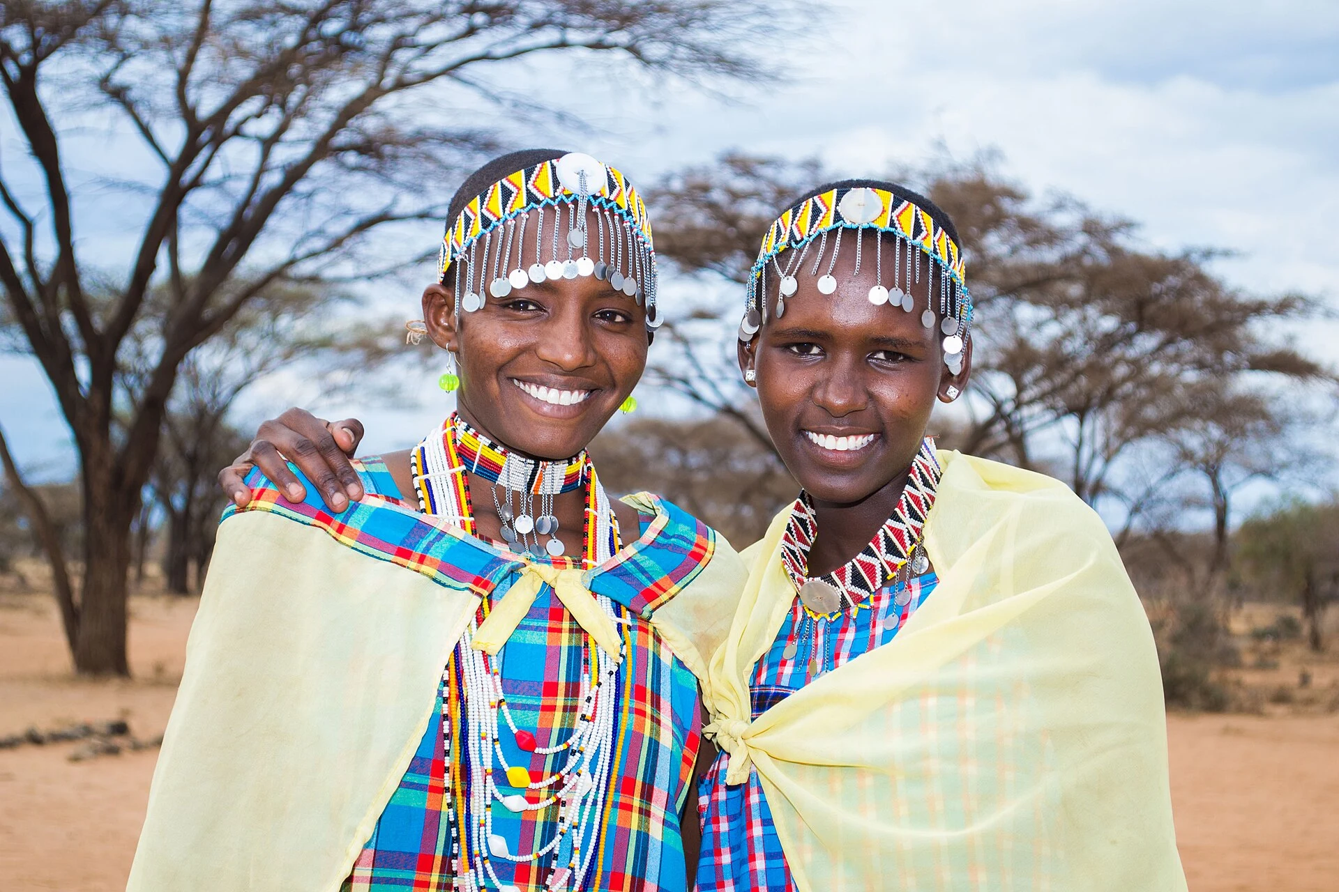 Two smiling Maasai girls in beaded collars