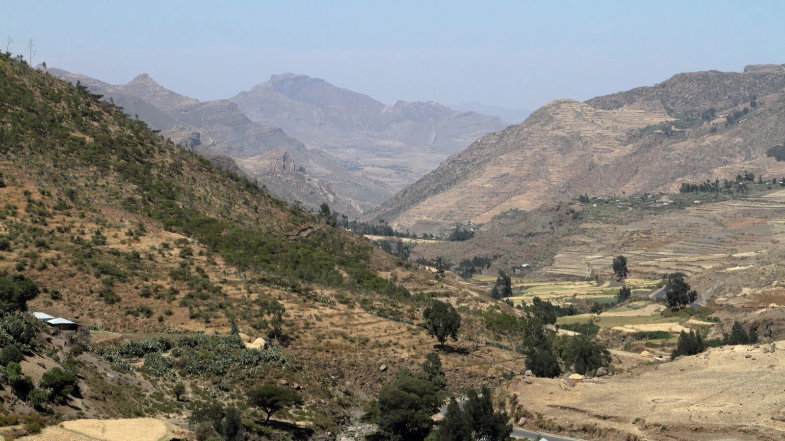 Dry hazy valley with terraced fields in the Ethiopian highlands