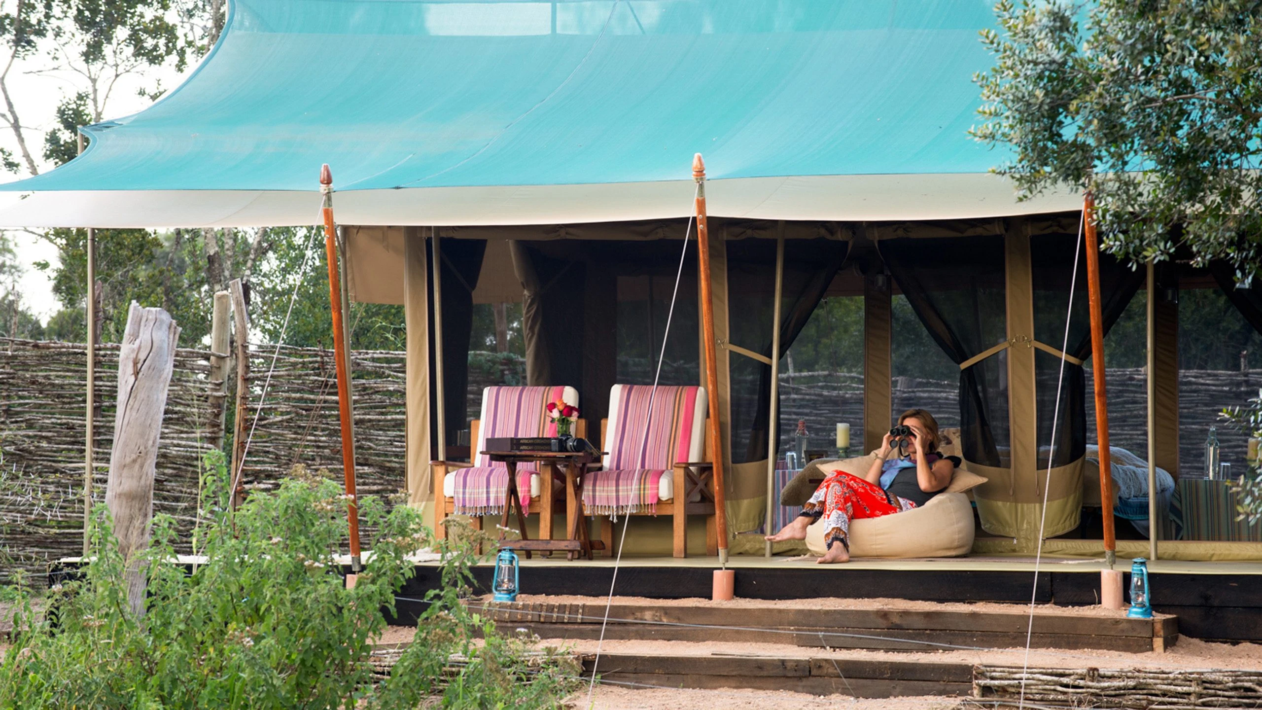 Open canvas lodge with deck chairs at Ol Pejeta Bush Camp