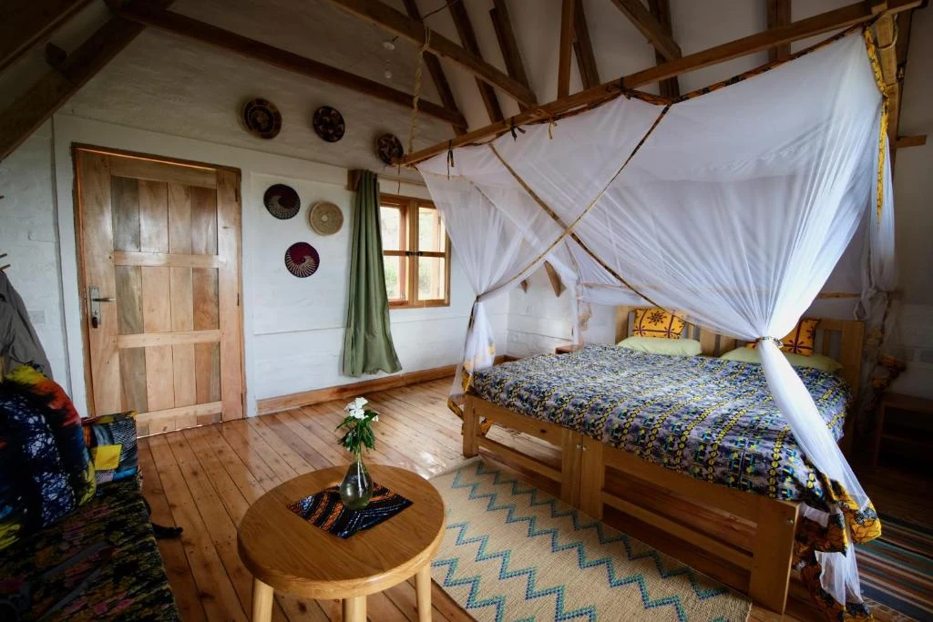 a bedroom with a canopy bed and a table