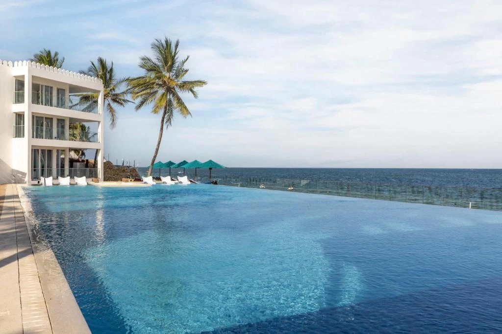 a swimming pool with a view of the ocean