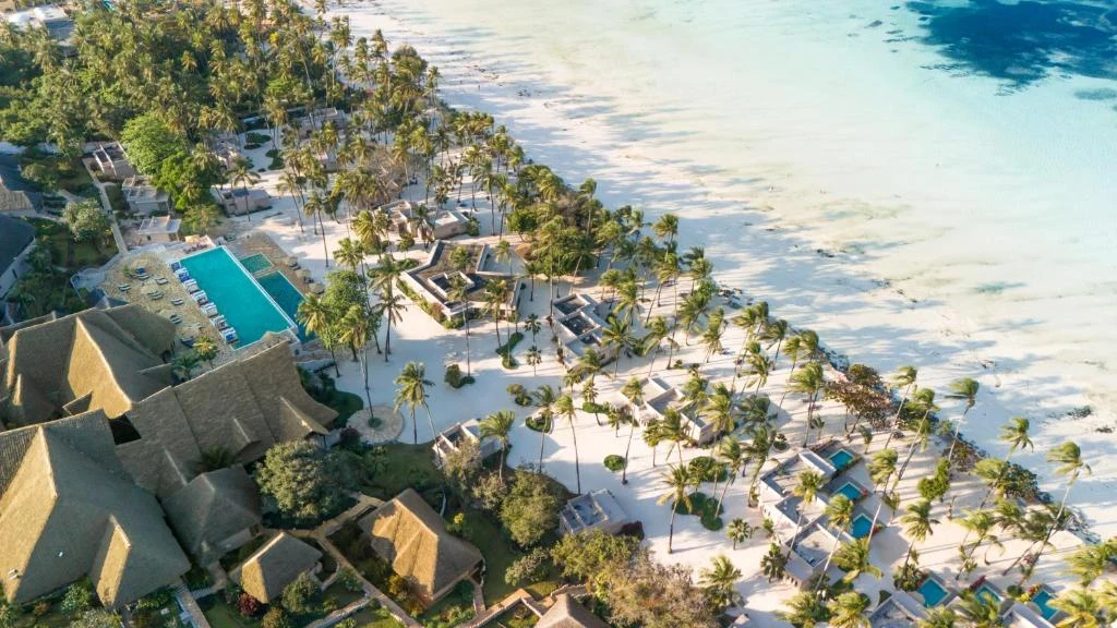 an aerial view of a resort on the beach