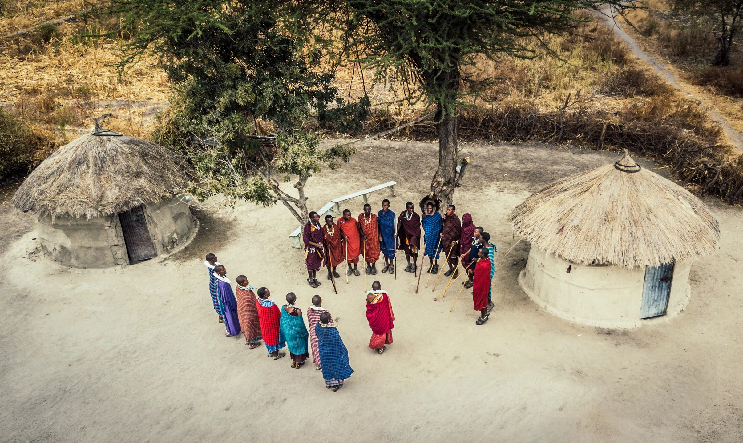 Maasai dancers in a circle inside a boma near the crater