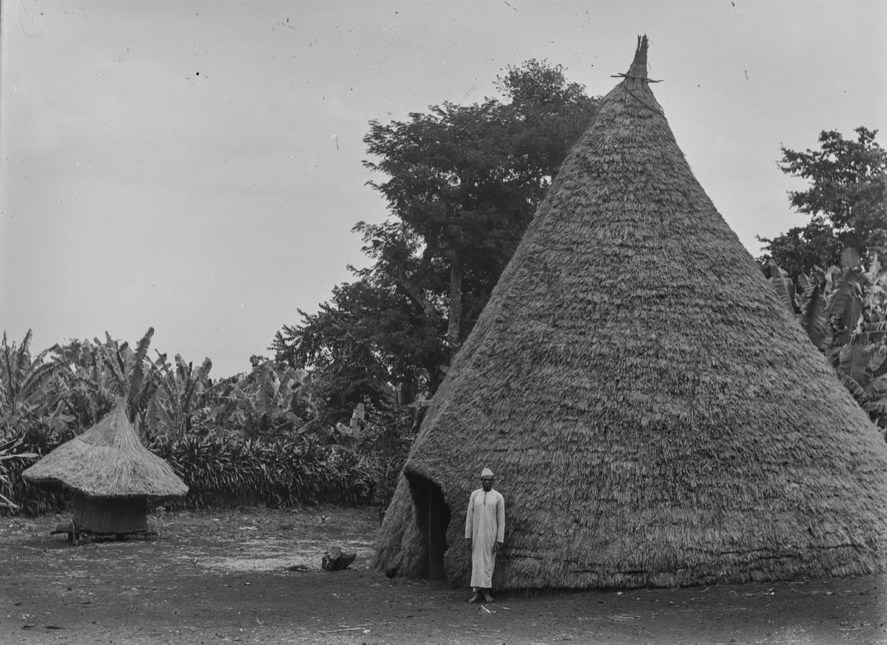 Historic photo of a traditional Chagga house with a thatched roof