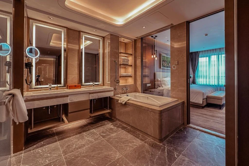 a bathroom with a tub and a sink at Ethiopian Skylight Hotel in Addis Ababa