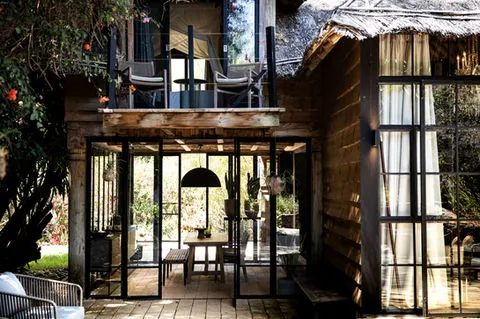 Segera glass-fronted two-level house detail; exact category unassigned