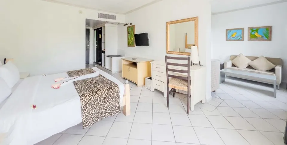 Diani Reef Deluxe bedroom and sitting area