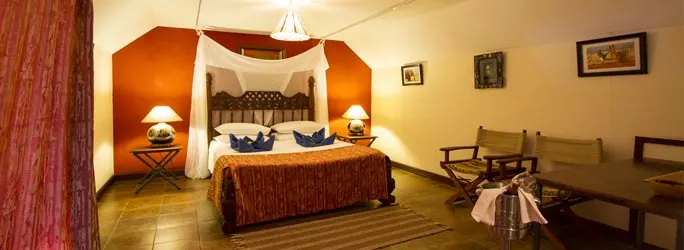 Zomeni Lion Hill bedroom with netted double bed