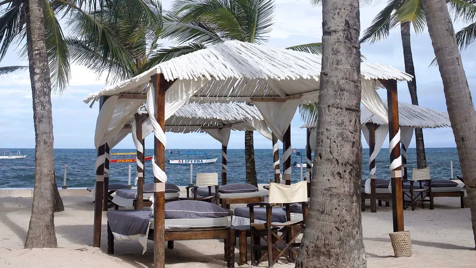 Billionaire Resort & Retreat beachfront gazebo and loungers