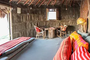 Original Maasai Lodge bungalow sitting and sleeping area